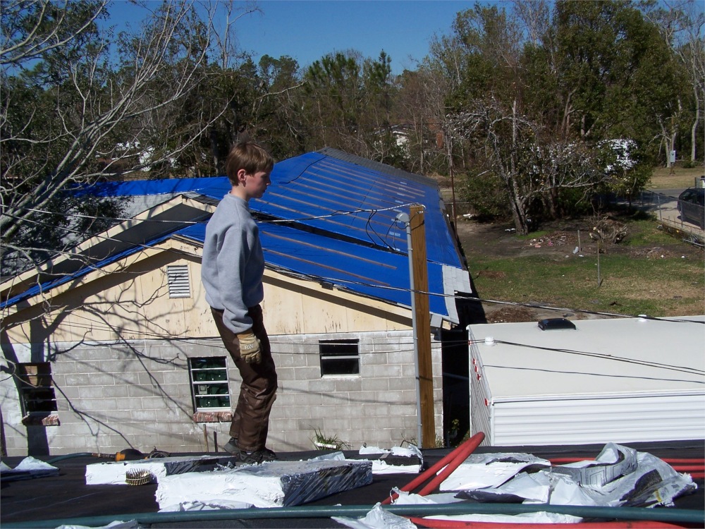 Photo of me on a church mission trip to help rebuild after Hurricane Katrina