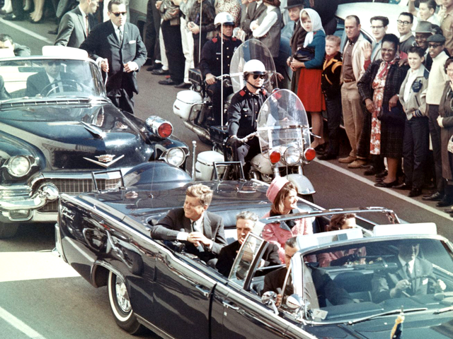 Photo of JFK in the presidential motorcade moments before his assassination.